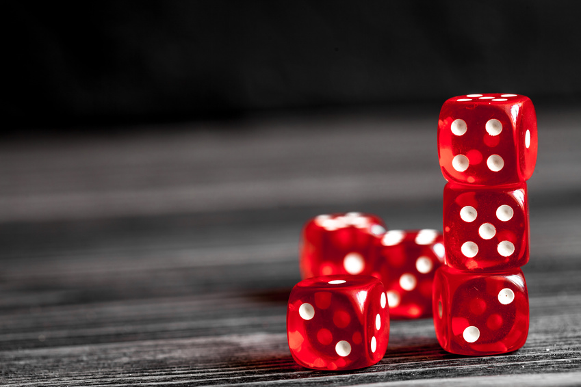 dice gambling on dark wooden background.